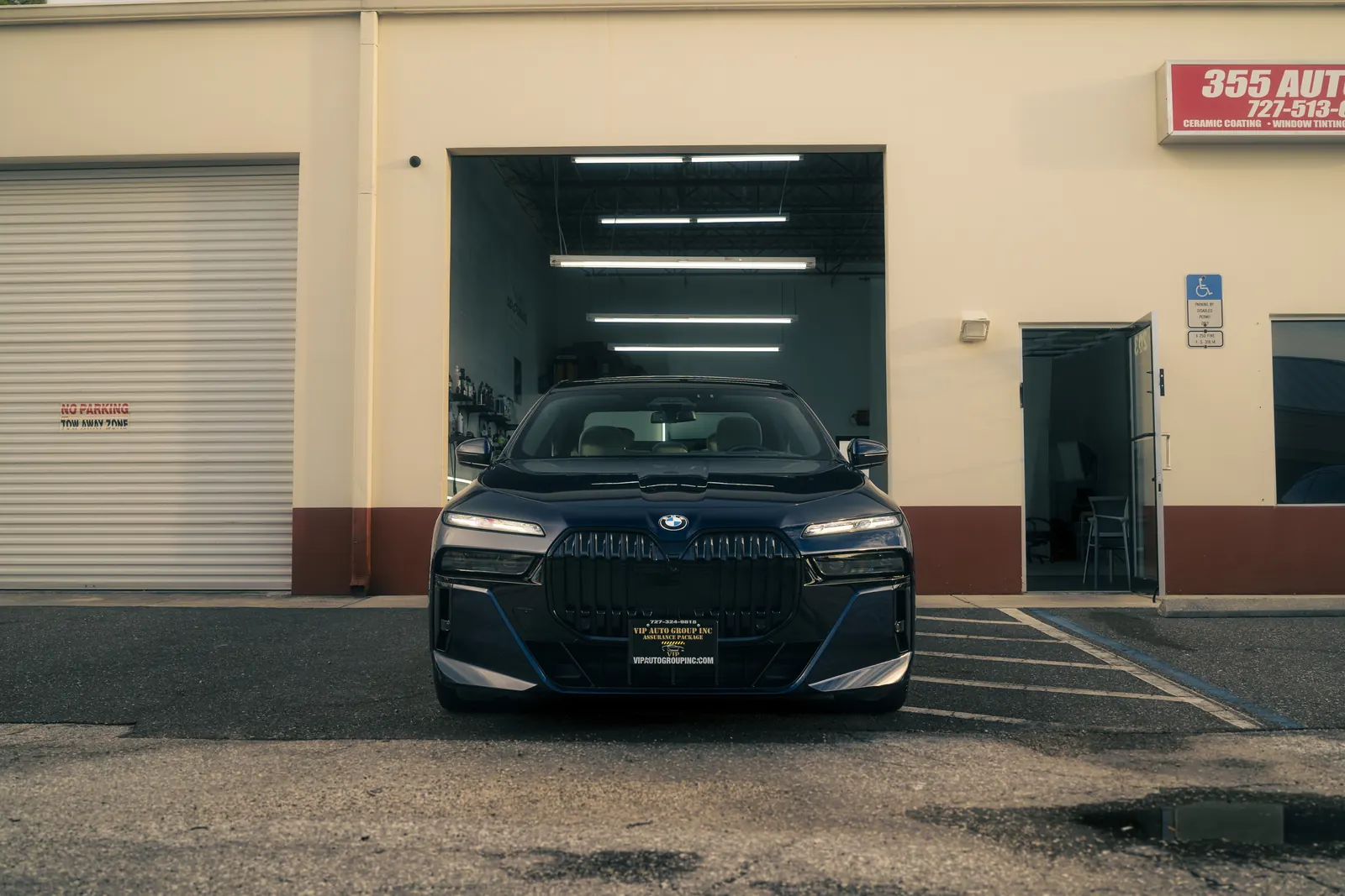355 Auto Spa shop front on Belcher Rd in Largo, FL, with a detailed BMW 760i outside the bay