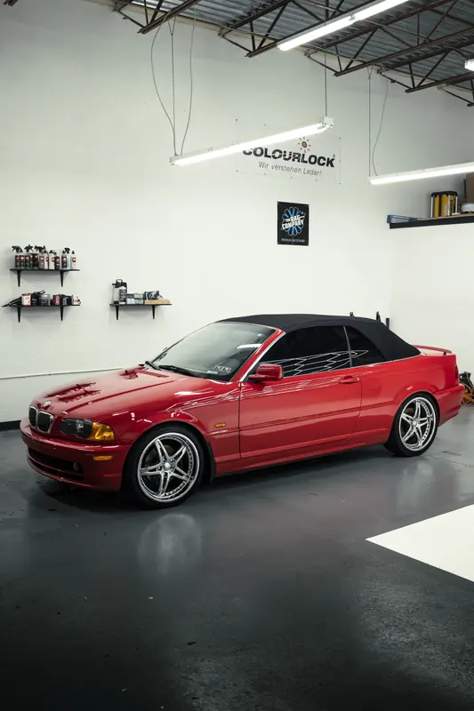 Red BMW 330Ci convertible side profile