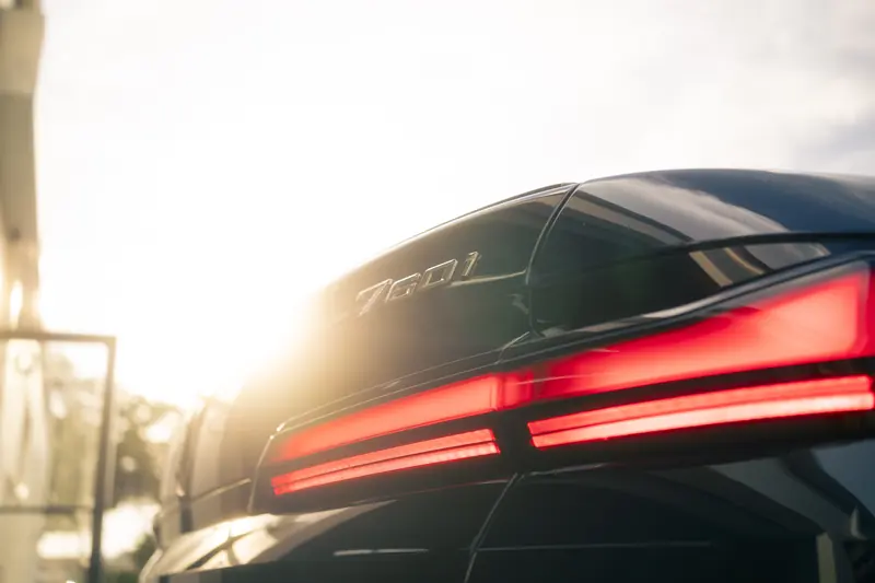BMW 760i badge and light bar with sunset flare