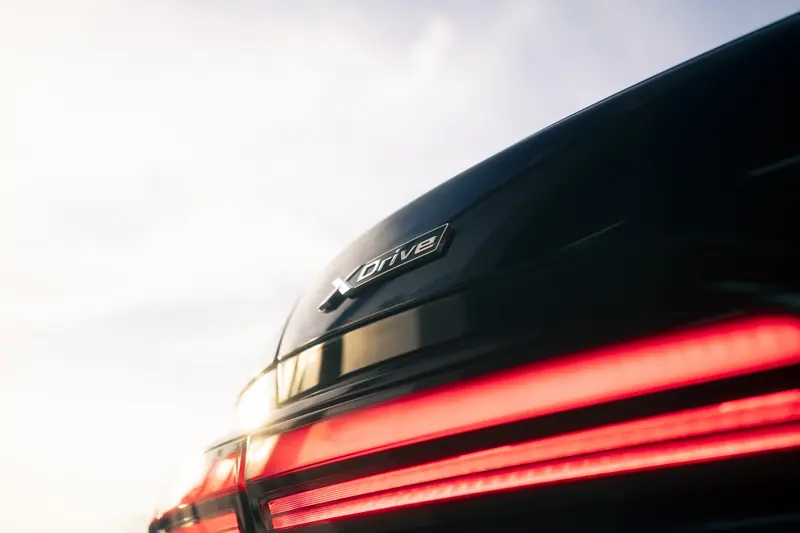 BMW xDrive badge above the lit taillight