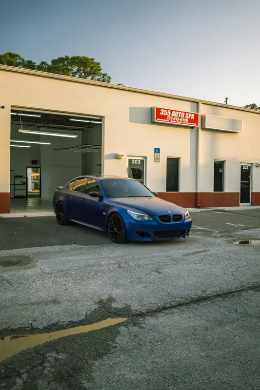 Matte blue BMW M5 outside 355 Auto Spa