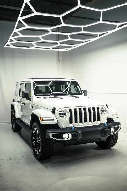 Jeep Wrangler 4xe grille under a hexagon light ceiling
