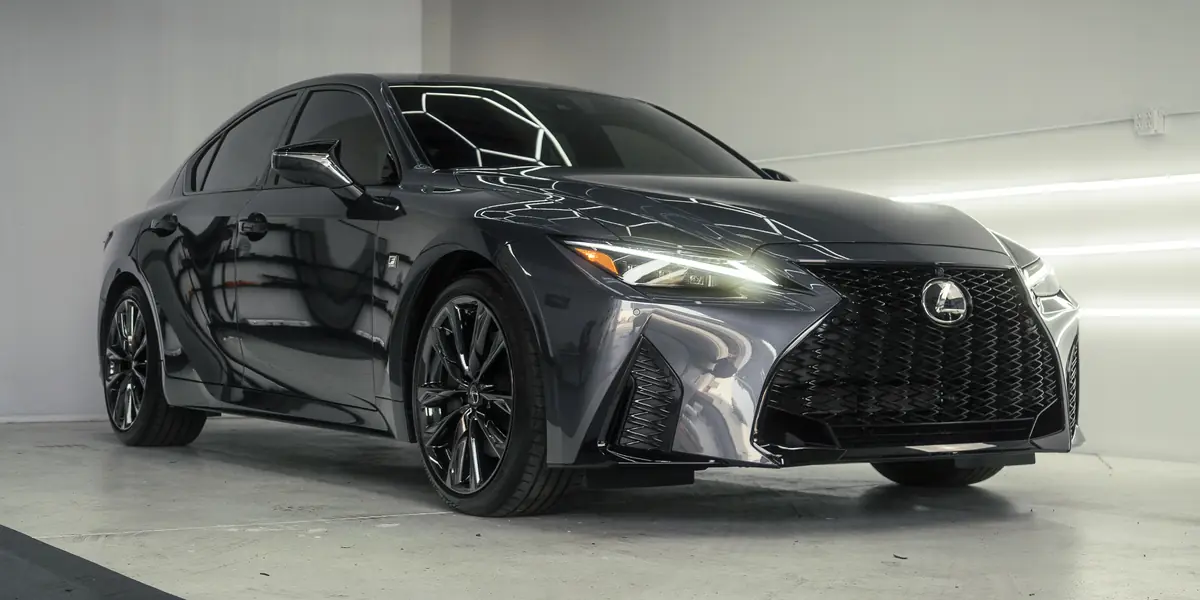 Grey Lexus IS 350 F Sport under the hex lights after a detail
