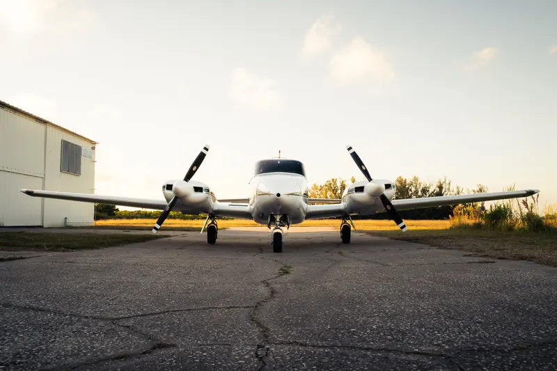 Detailed Piper Twin Comanche nose-on on the taxiway