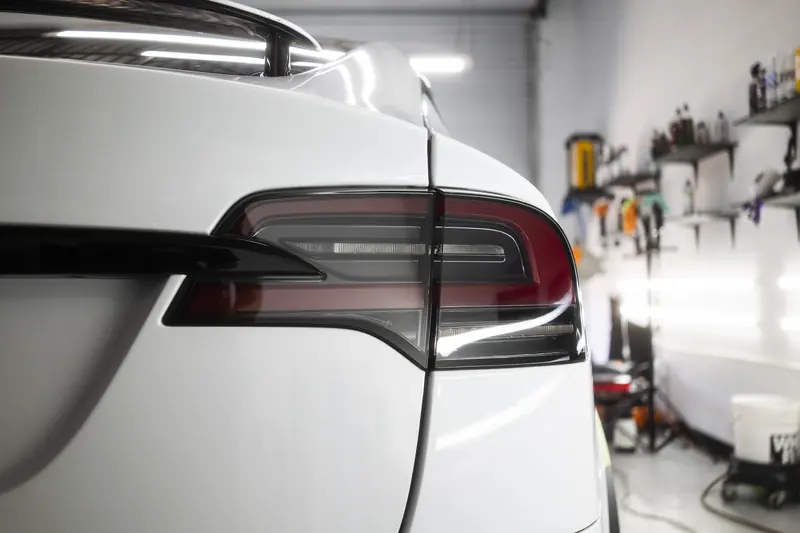 Tesla Model X taillight and gloss white paint after correction