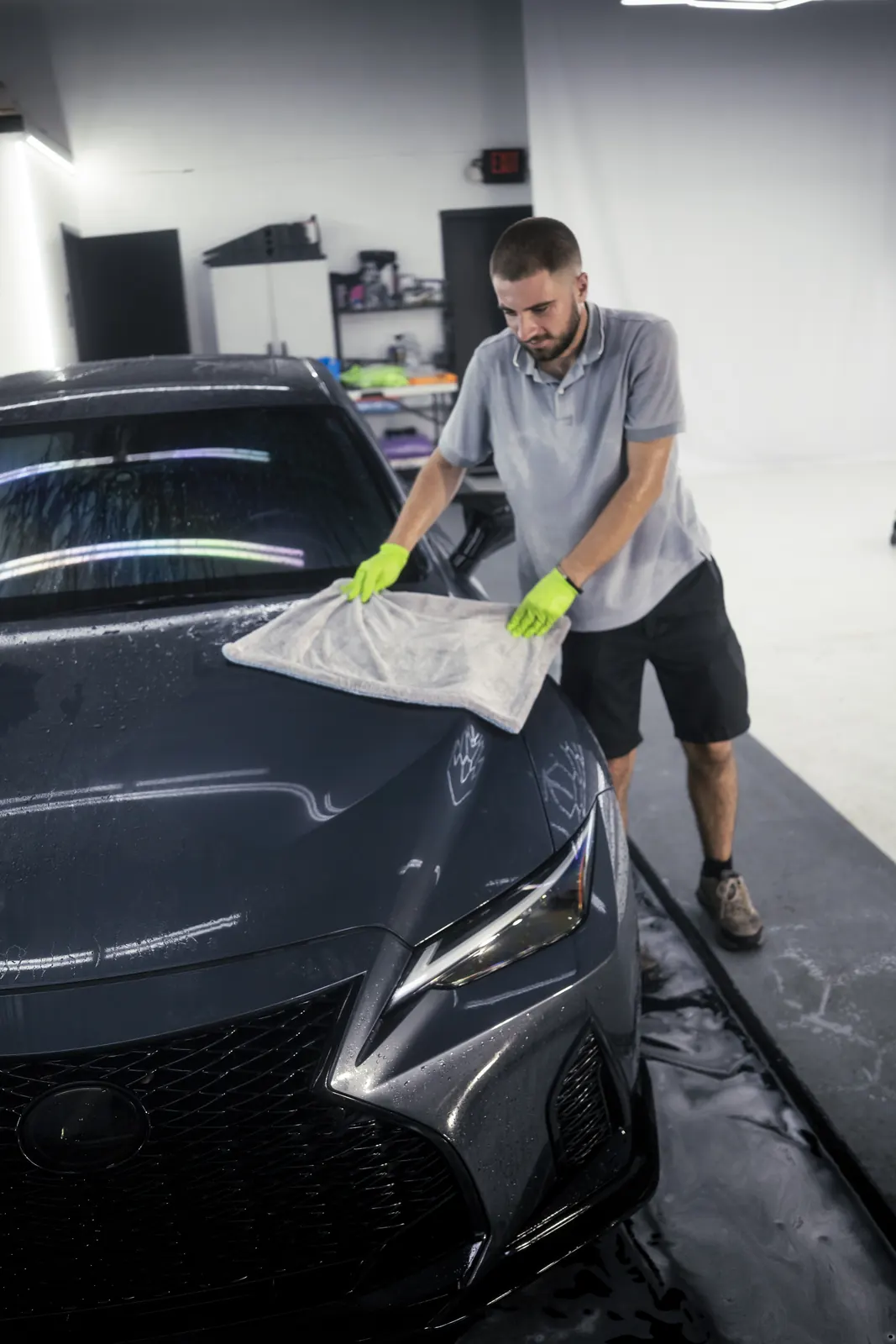 Lexus IS hand-dried with a microfiber towel in the bay