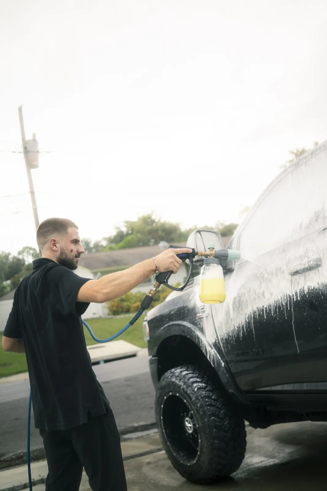 RAM truck foam-washed in the owner's driveway