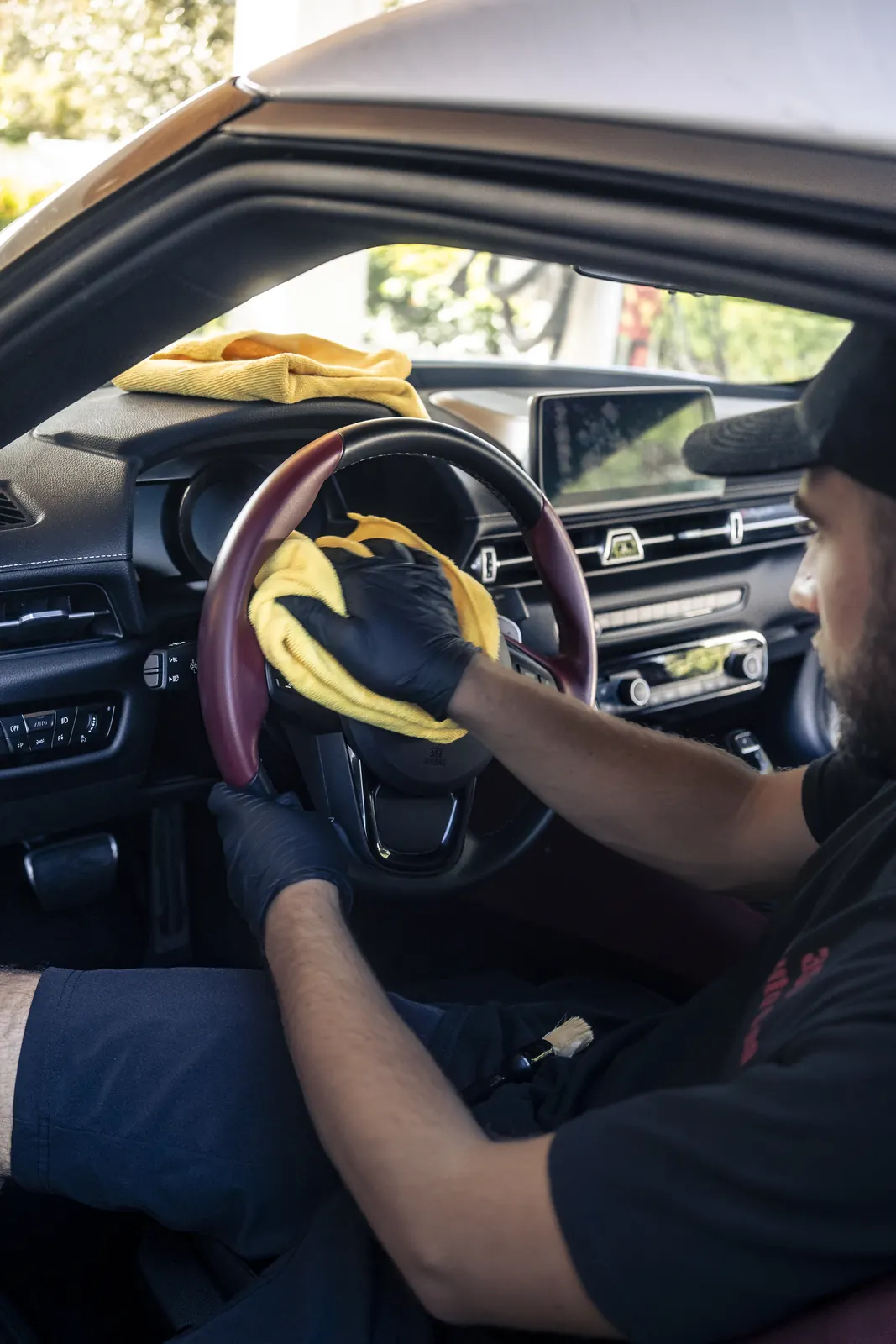 Steering wheel and cabin detailed on site in a Toyota Supra